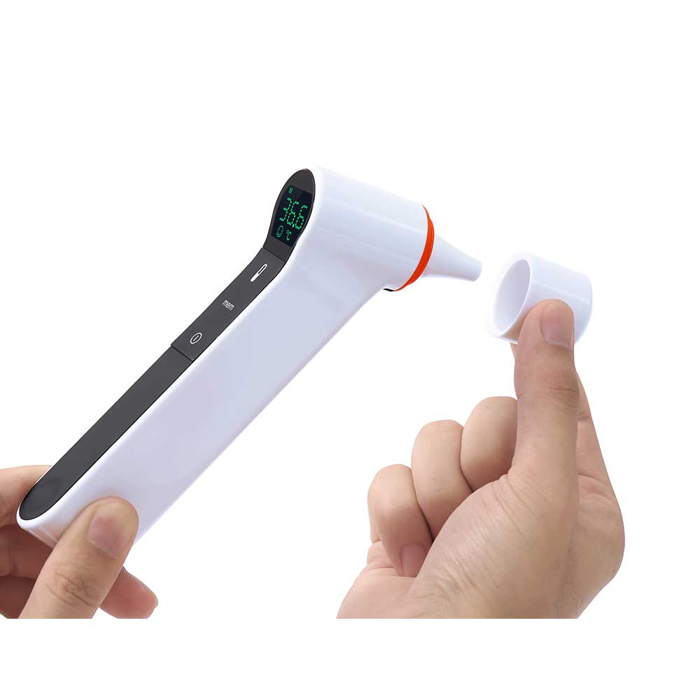 Hand holding a white ear thermometer with digital display on a white background