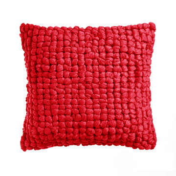 Red textured pillow on a white background
