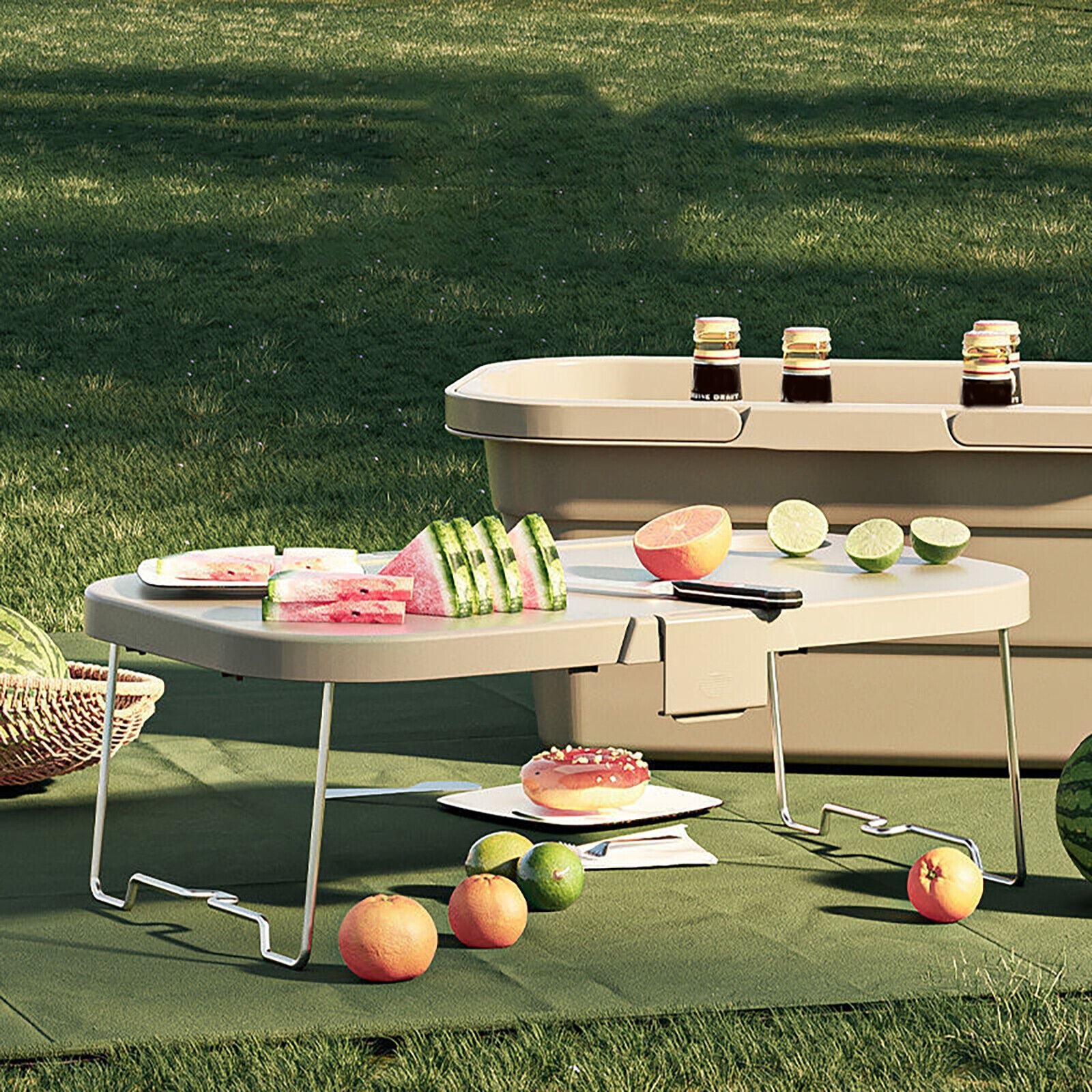 Outdoor setting with a small table displaying fruits and drinks on a grassy background