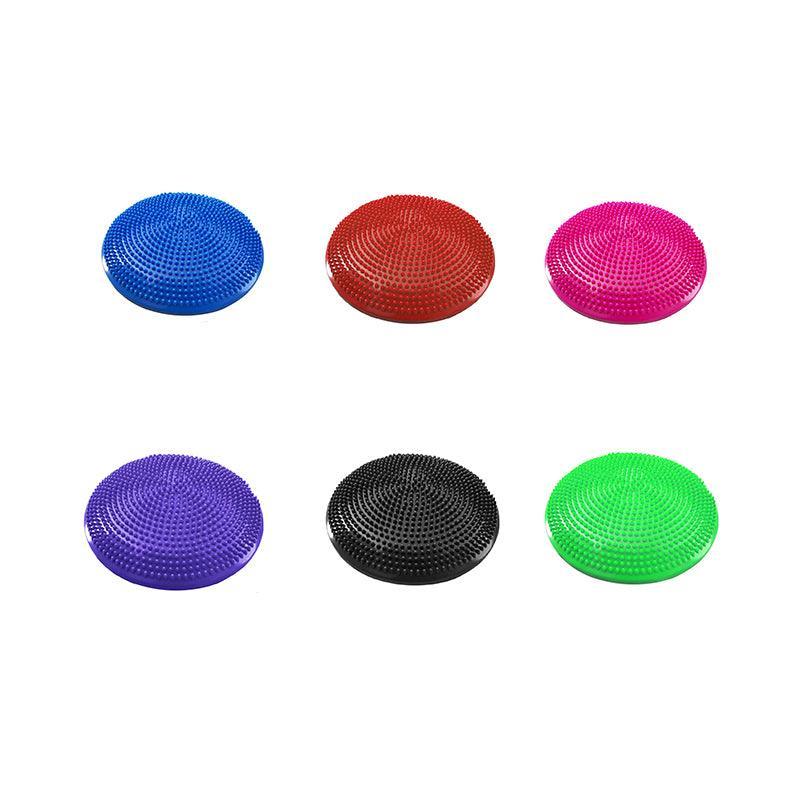 Set of six colorful round massage cushions on a white background