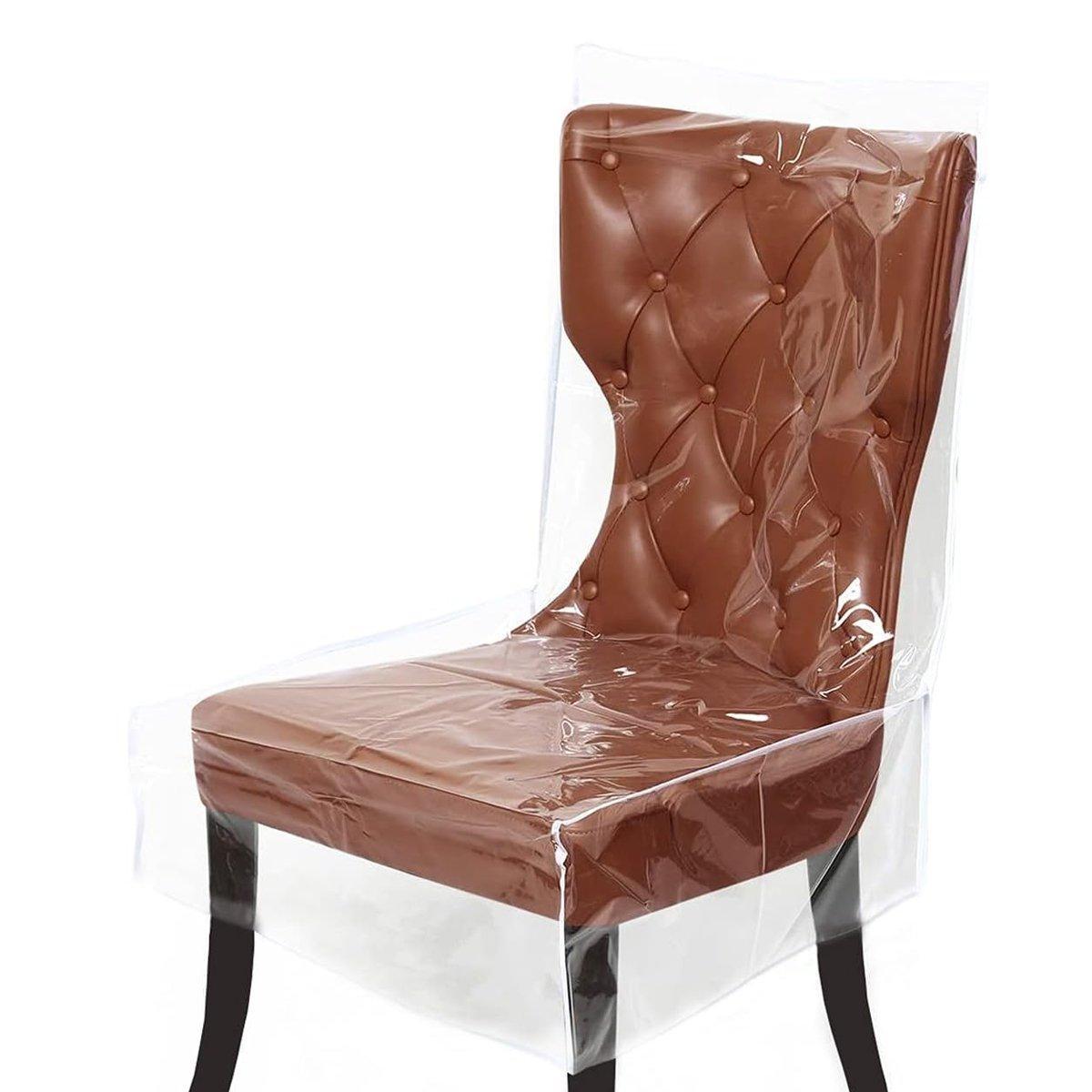 Brown upholstered chair with clear plastic cover on a white background