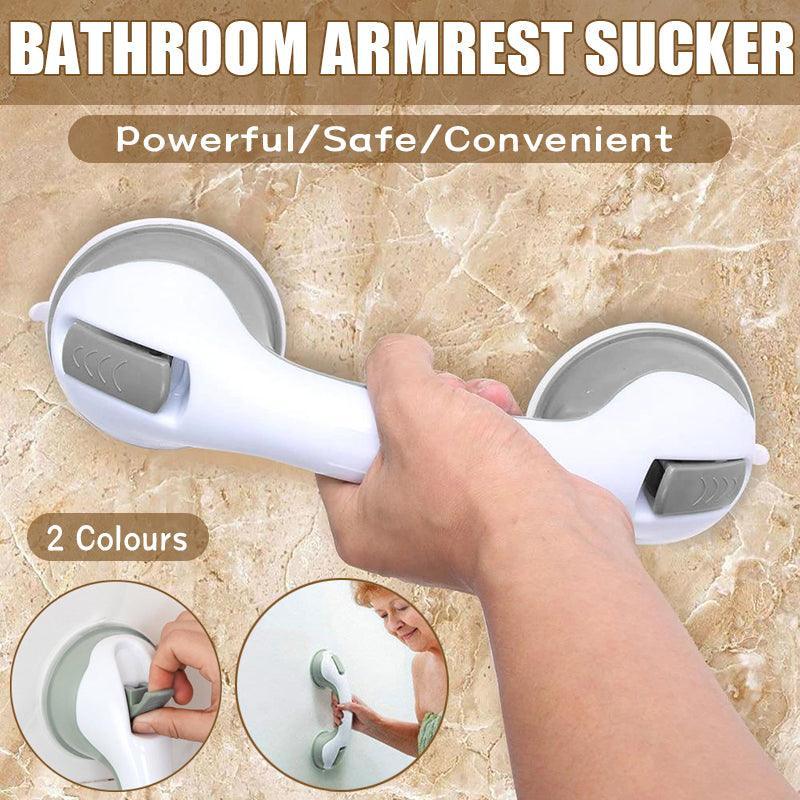 Bathroom armrest sucker with a hand holding it on a tiled wall background.