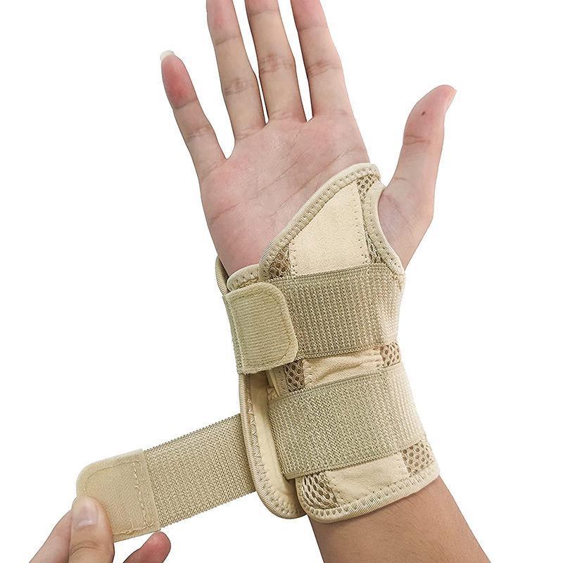 Beige wrist brace on a person's wrist against a white background