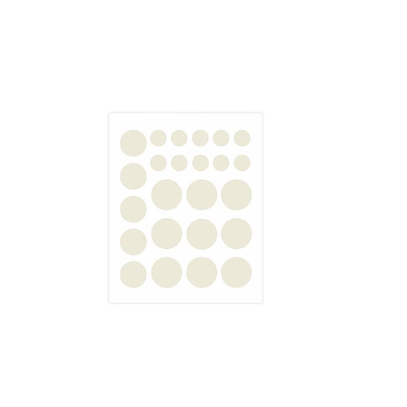Set of cream-colored circular stickers on a white background