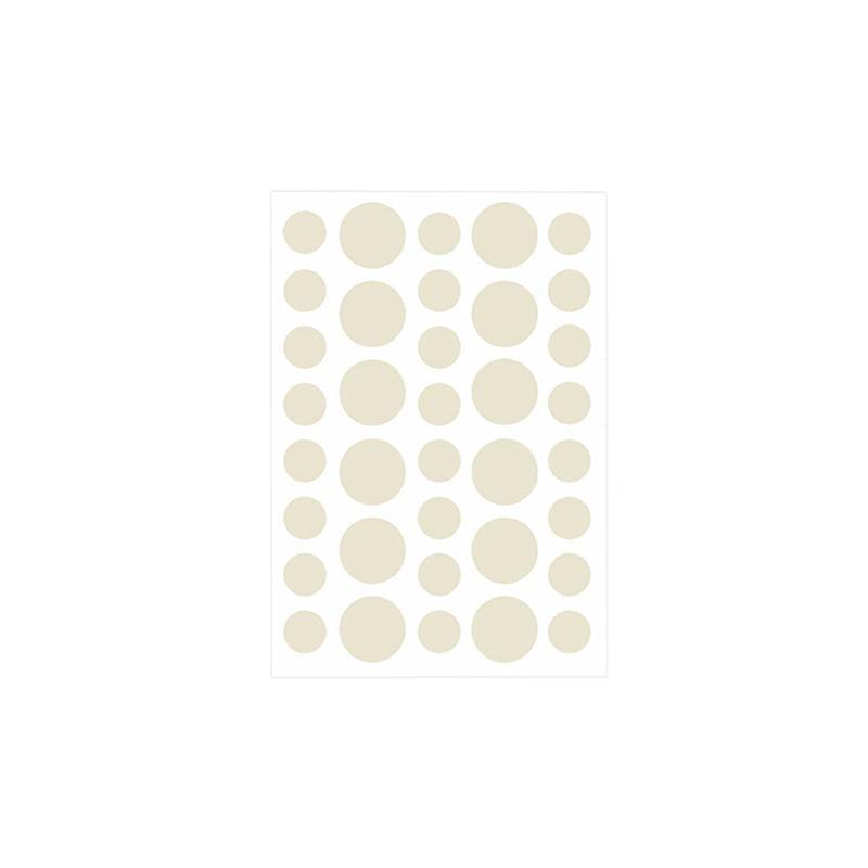Sheet of beige round stickers on a white background