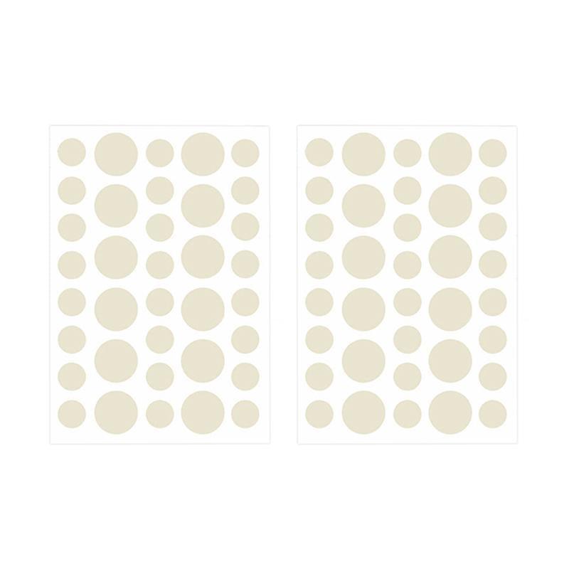 Set of cream-colored round stickers on a white background