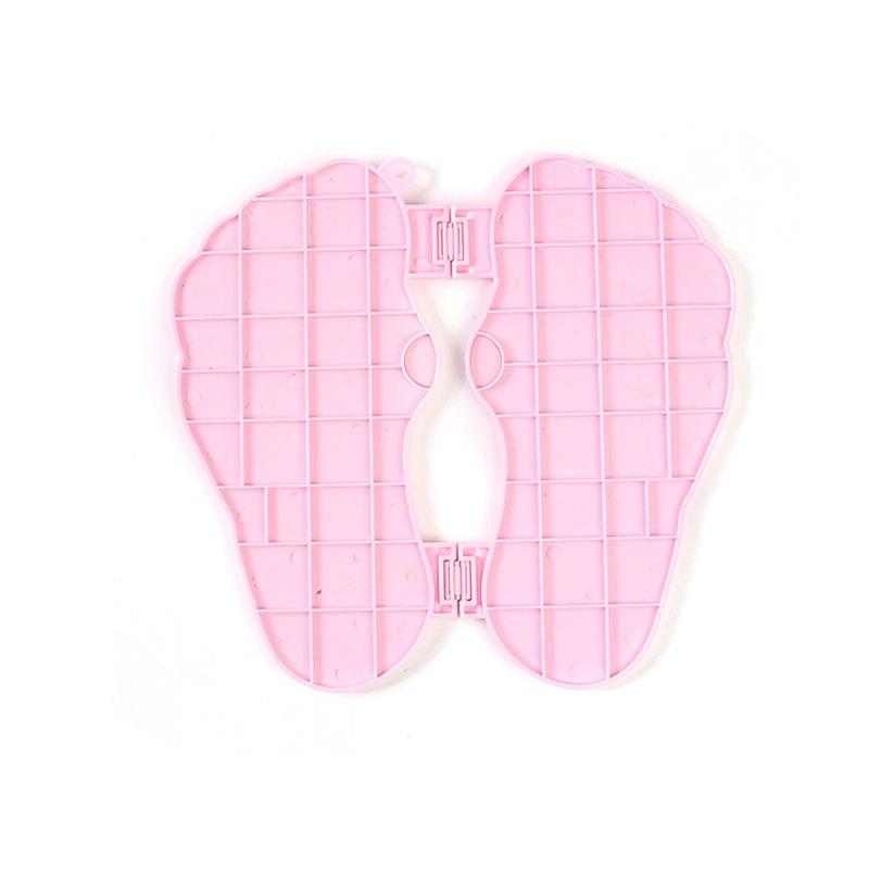 Pink neck pillow with grid pattern on a white background