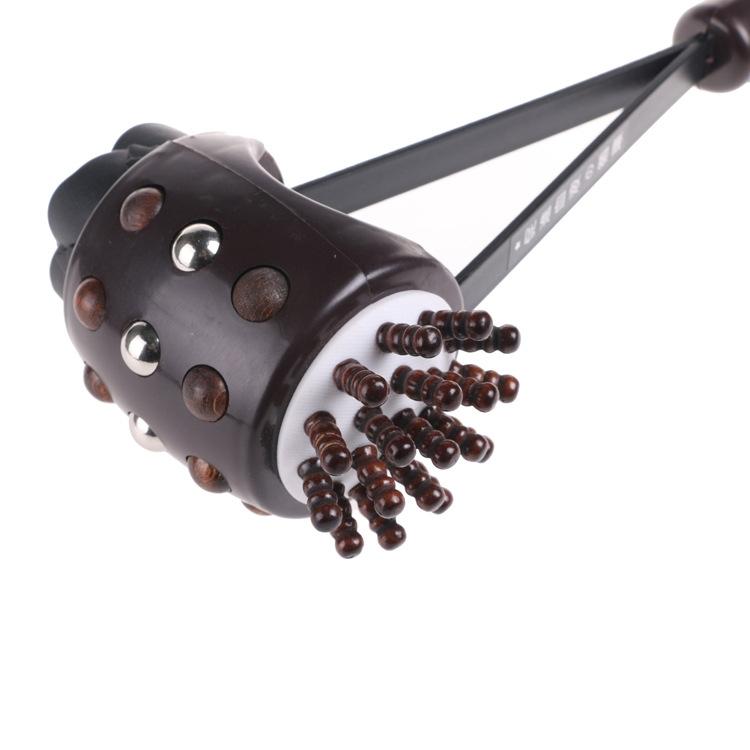 Massage tool with brown nodes on a white background