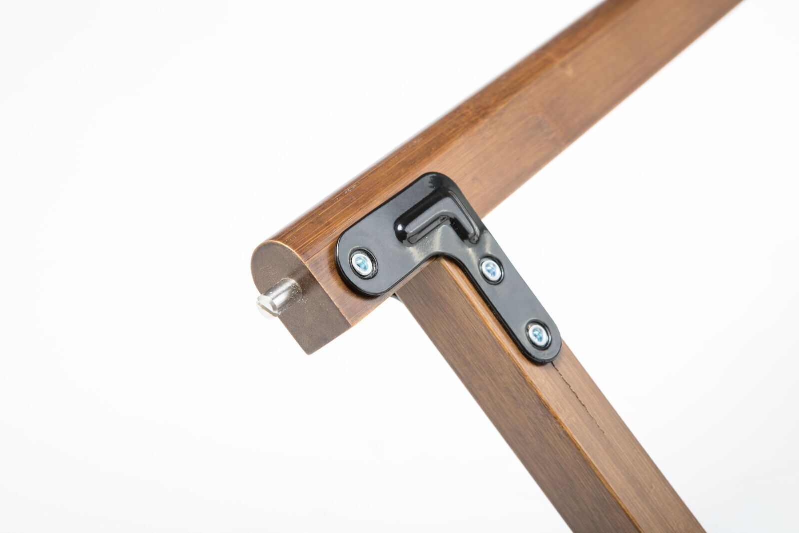 Wooden frame corner with metal hinge on a white background