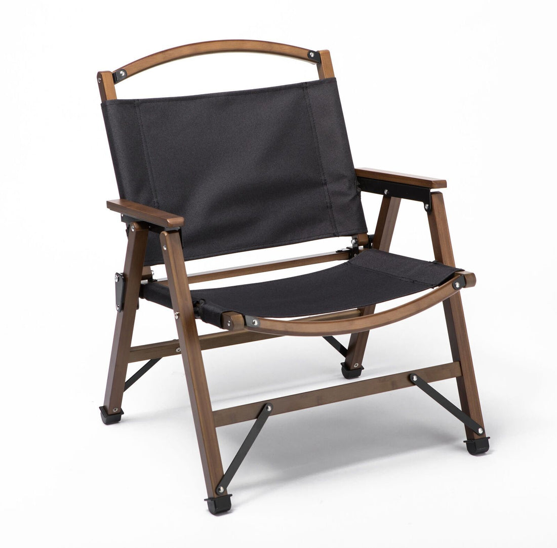 Wooden director's chair with black fabric on a white background