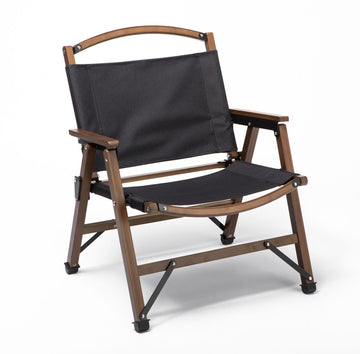 Wooden director's chair with black fabric on a white background