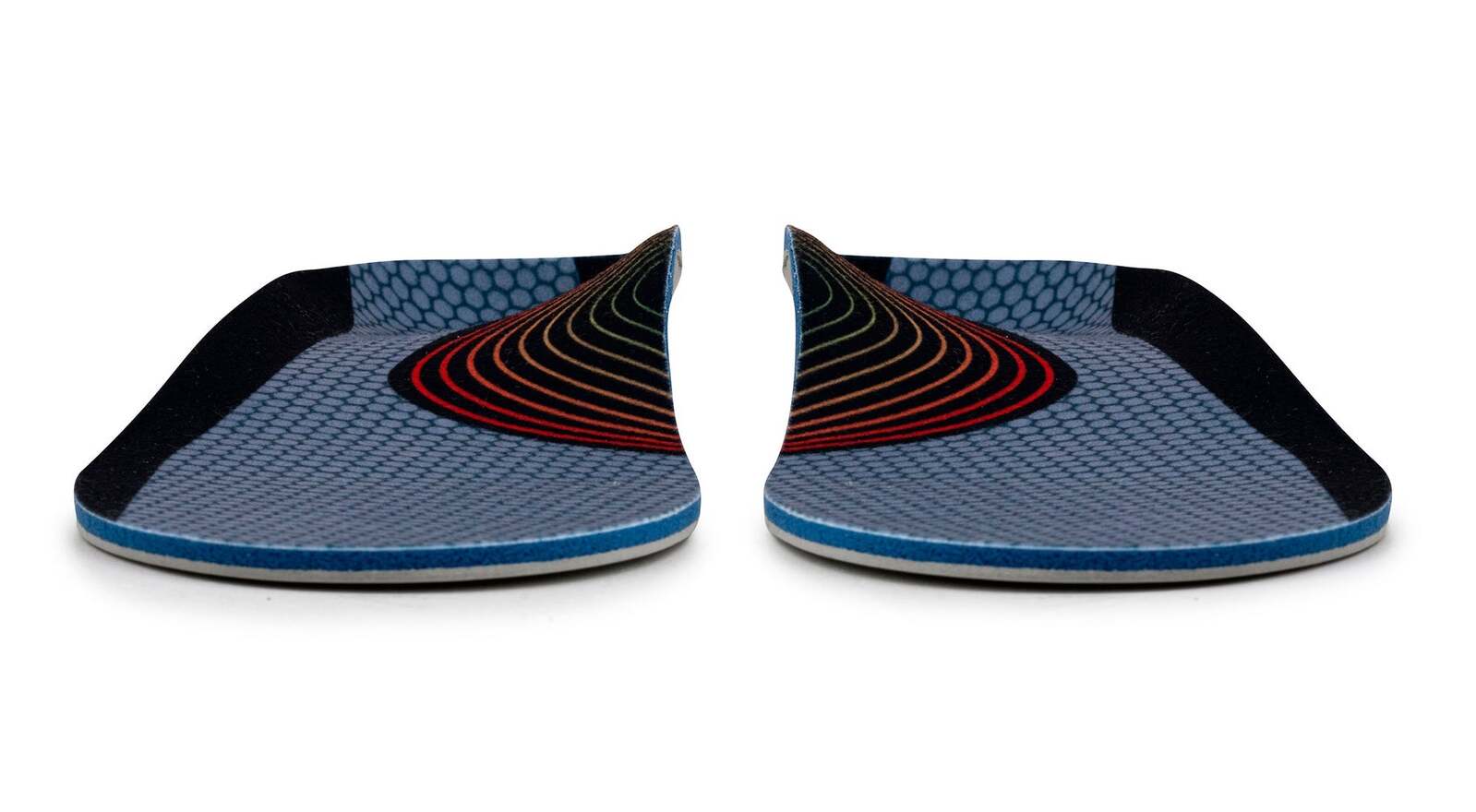 Pair of blue and black shoe inserts on a white background