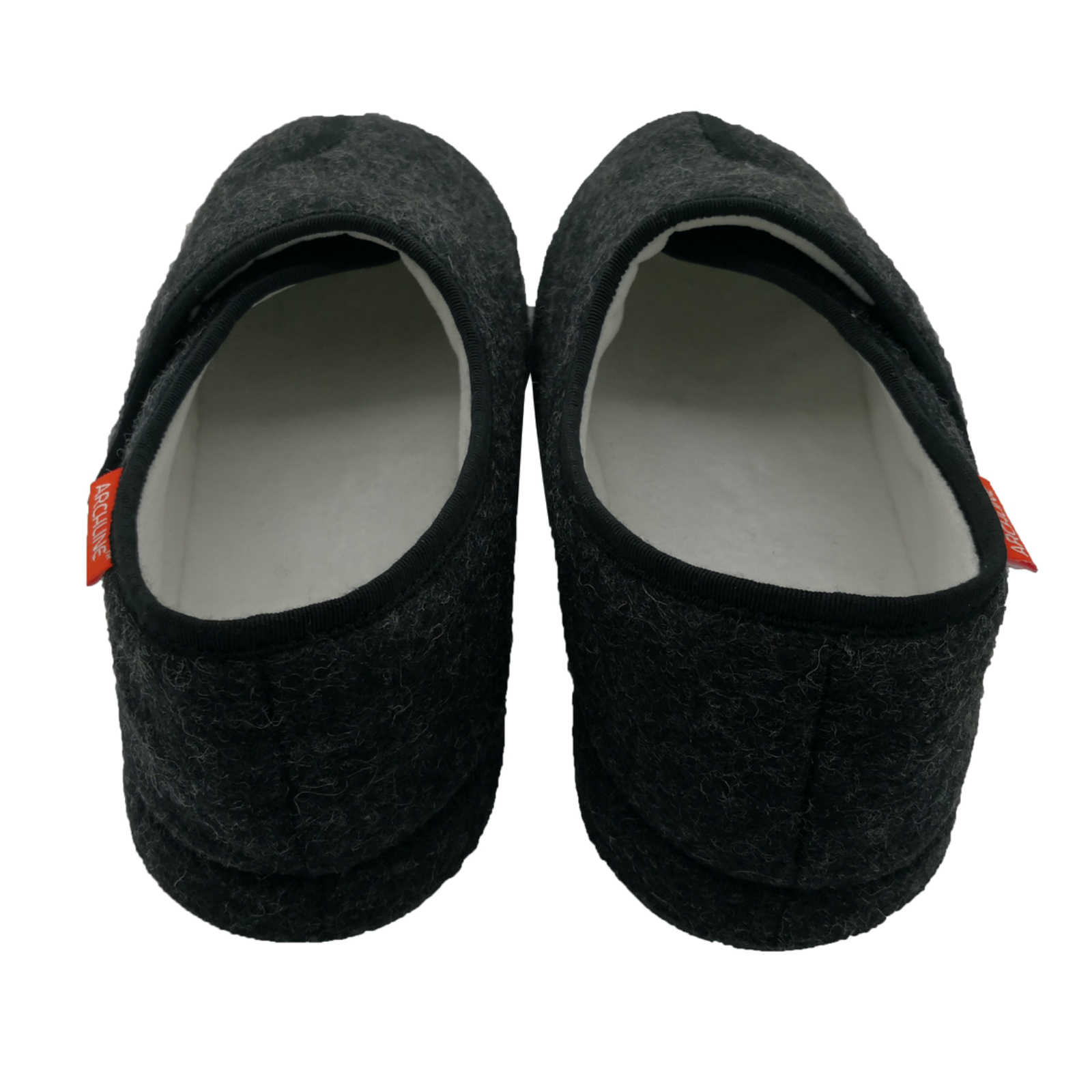 Pair of black slippers with a white interior on a white background