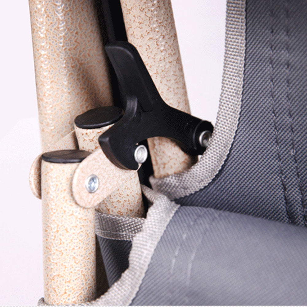 Close-up of a beige chair armrest with a black adjustable lever and gray cushion.