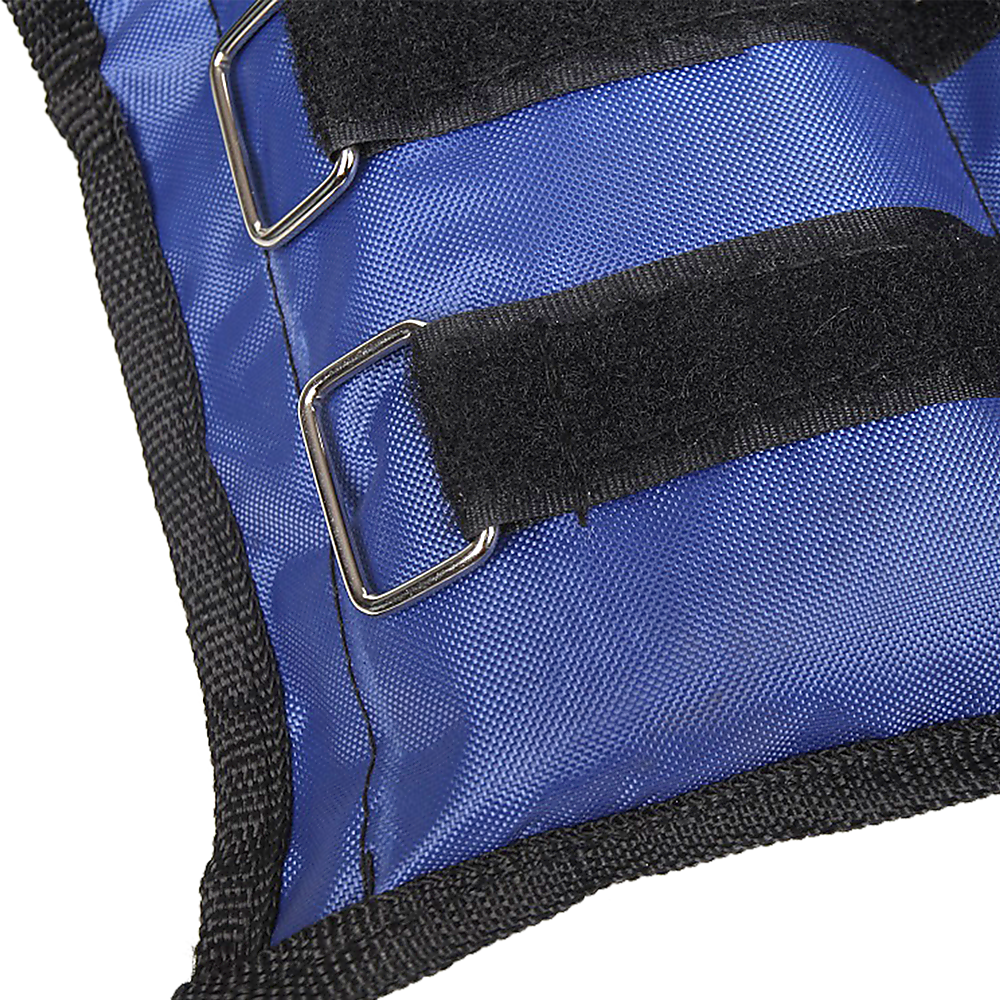 Close-up of a blue bag with black straps and metal buckles on a white background