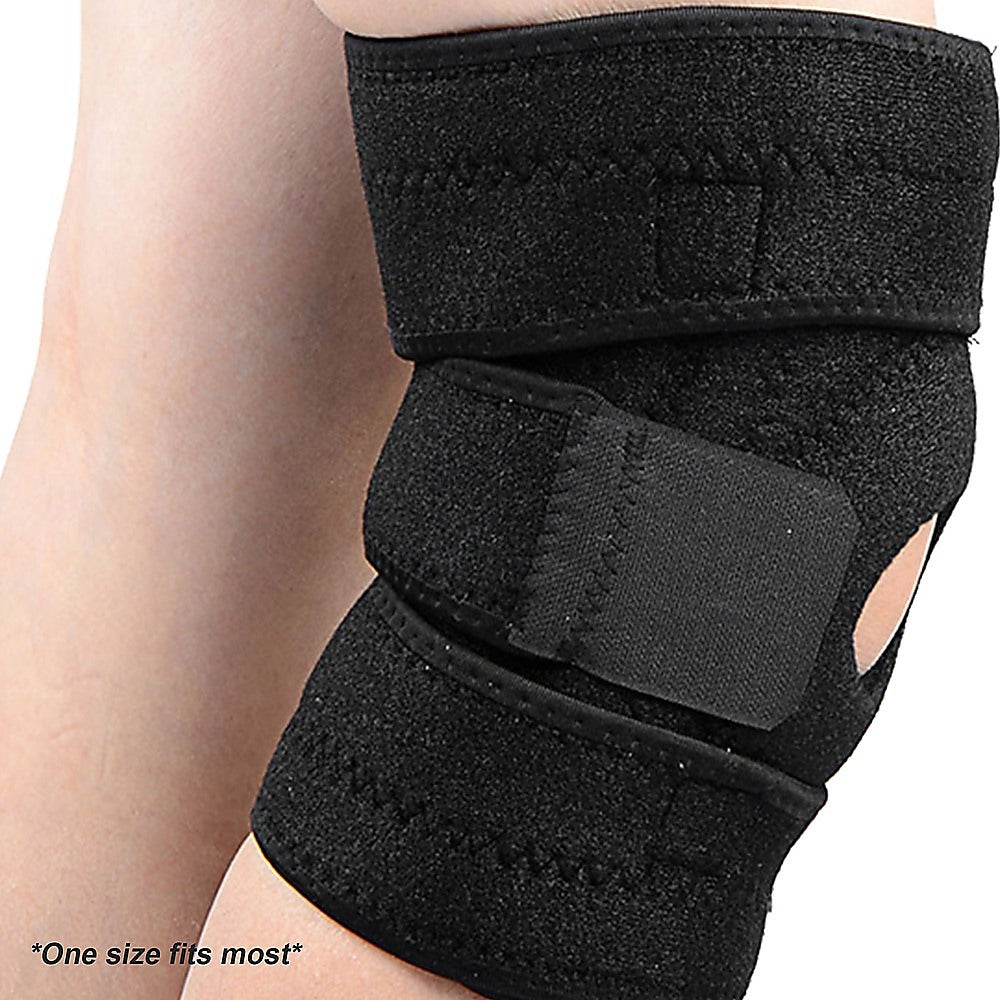 Black knee brace on a person's knee with 'One size fits most' text.