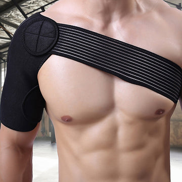 Black shoulder brace being worn by a person with a blurred background