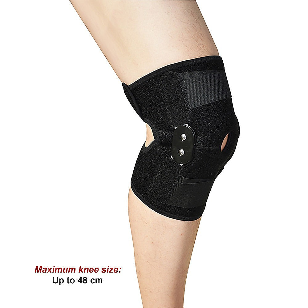 Black knee brace on a person's knee with text indicating maximum knee size.