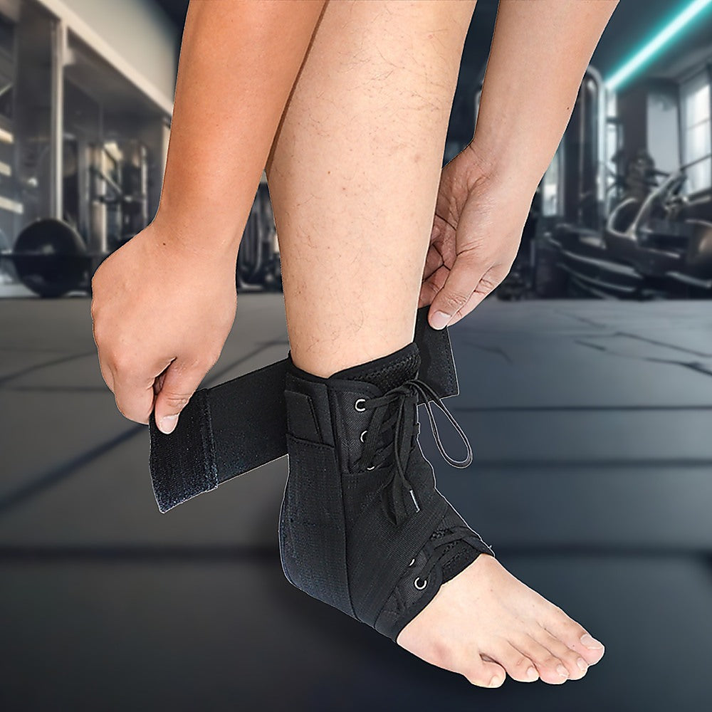 Person putting on a black ankle support brace in a gym setting