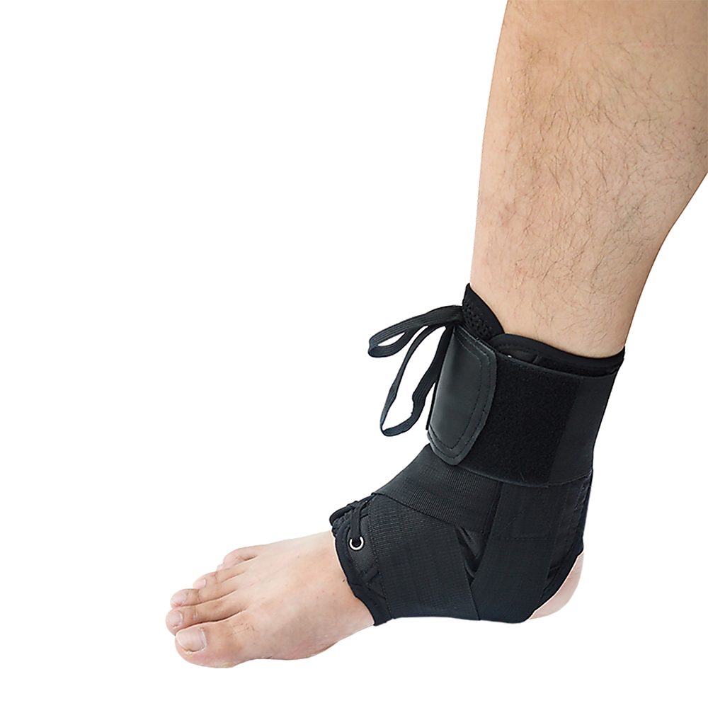 Black ankle support brace on a person's foot against a white background