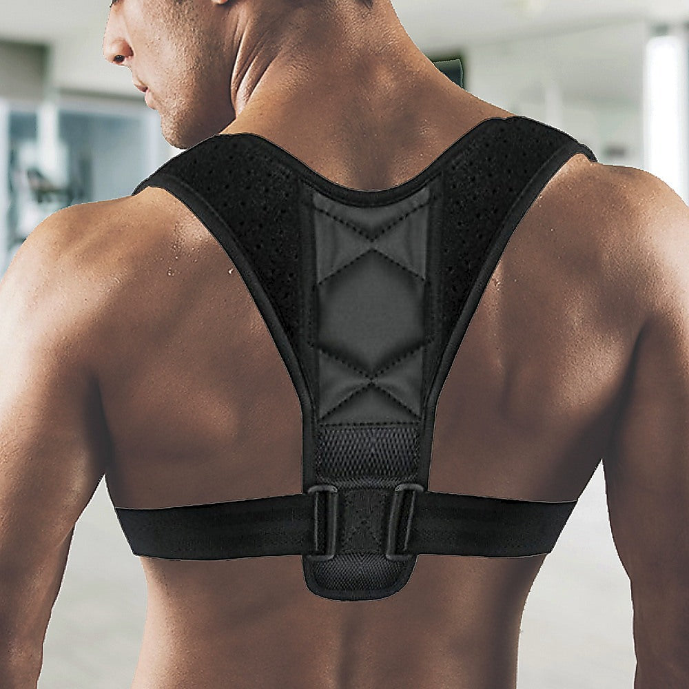 Black posture corrector worn by a person in an indoor setting