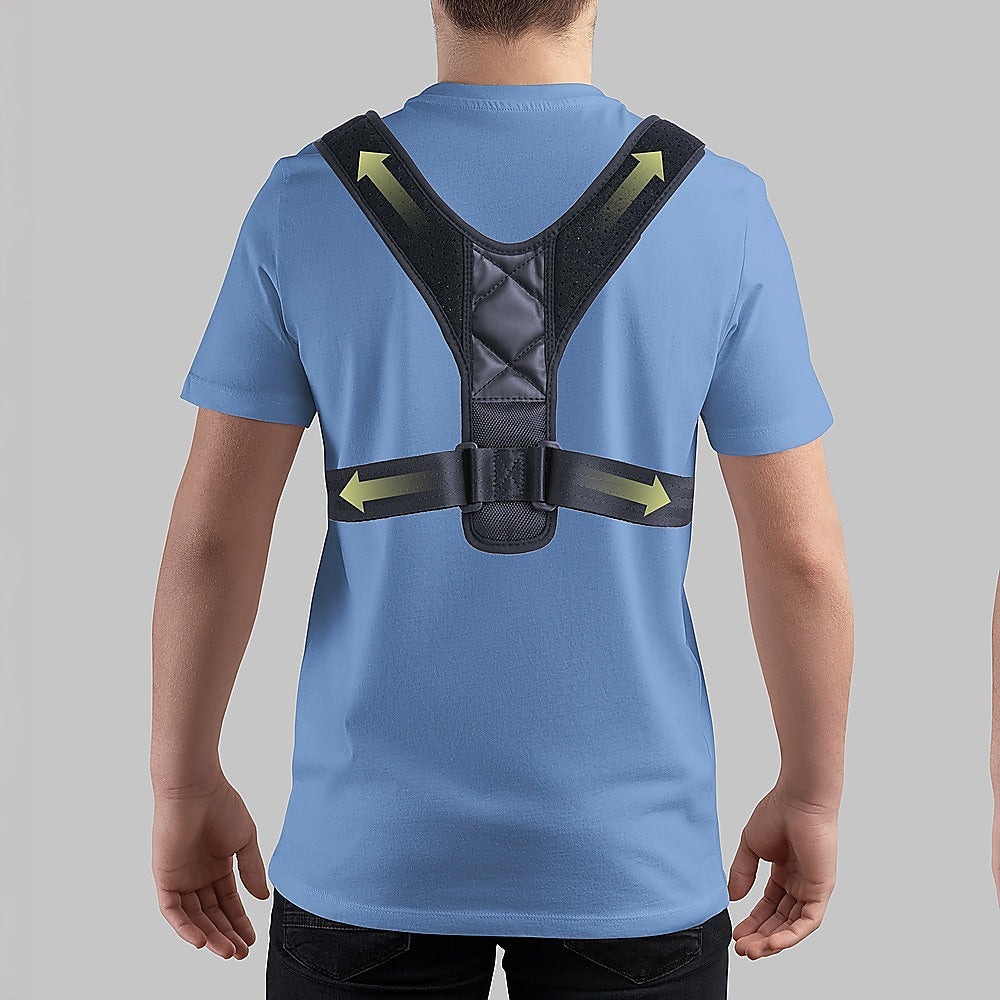 Person wearing a blue shirt with a black posture corrector on a gray background