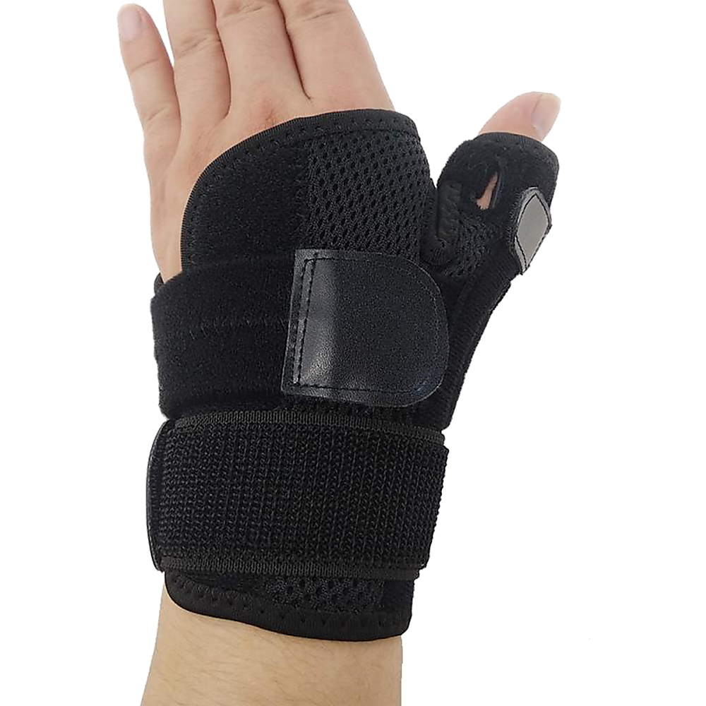 Black wrist support brace on a person's wrist against a white background