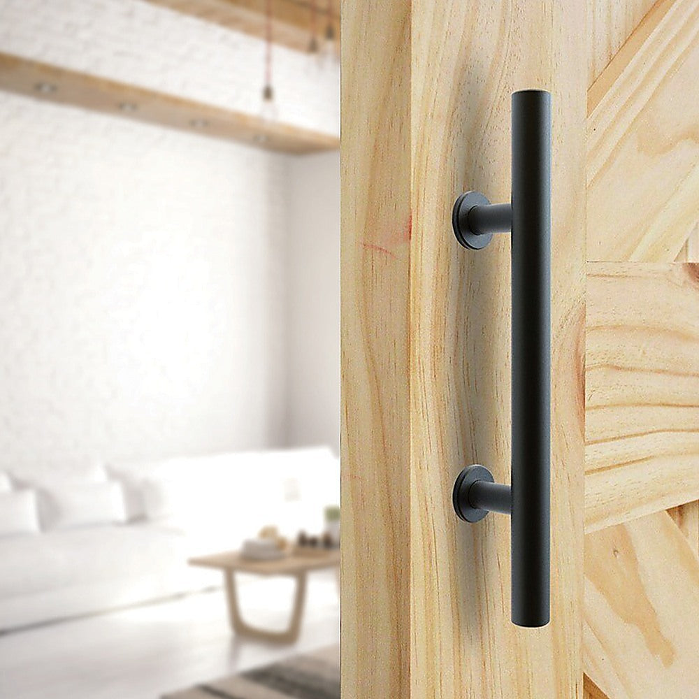 Wooden sliding door with black handle in a modern interior setting