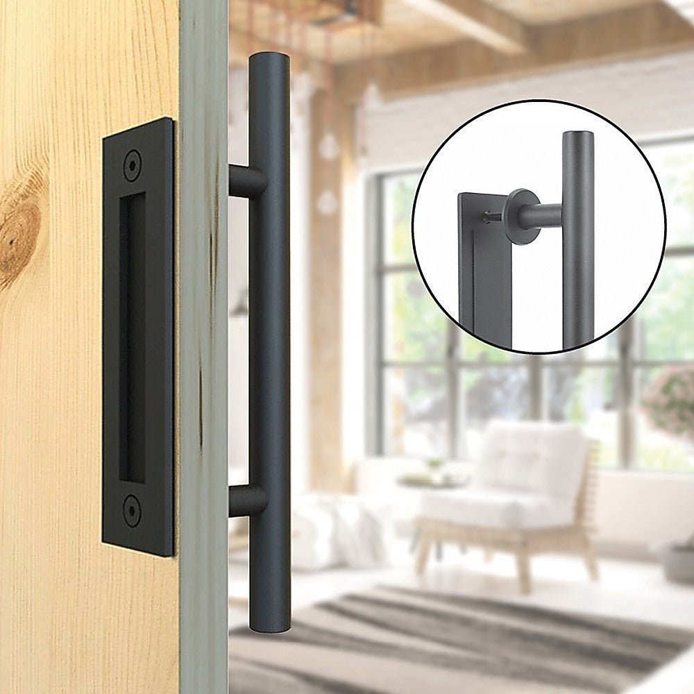 Black door handle on a wooden door with a blurred living room background