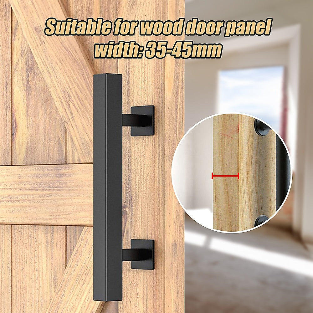 Black door handle on a wooden door with measurement details