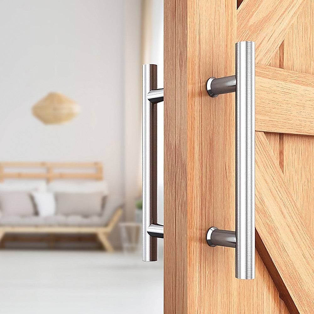 Wooden door with metallic handles in a room setting