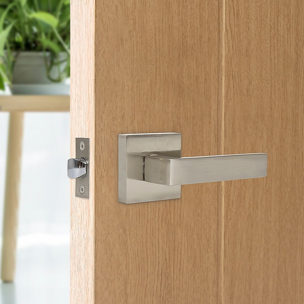 Wooden door with a metallic handle and lock mechanism.