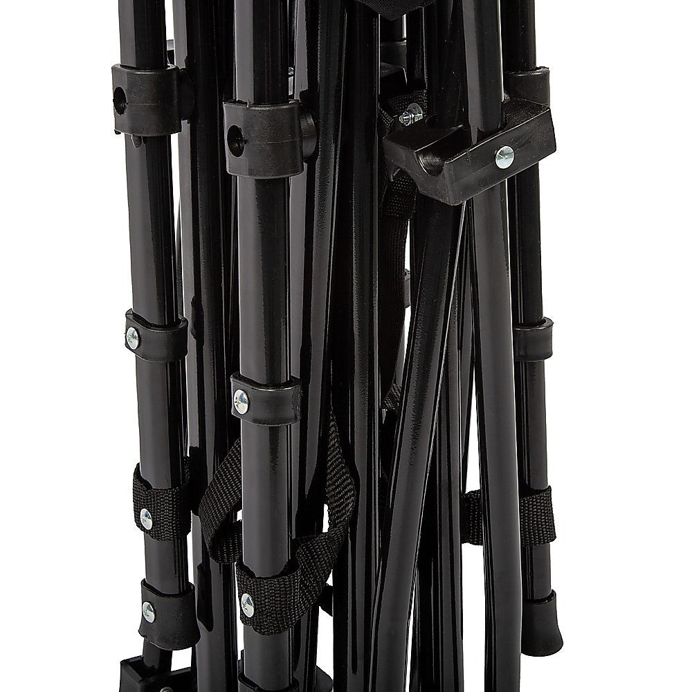 Close-up of a black metal tripod on a white background