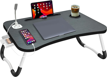 Foldable laptop desk with tablet, phone, and cup on a white background