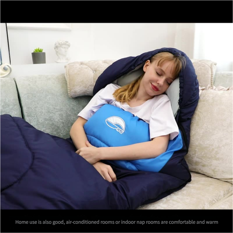 Person using a blue and navy inflatable pillow on a couch
