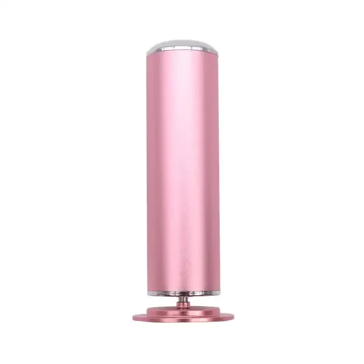 Pink cylindrical object with a metallic finish on a white background