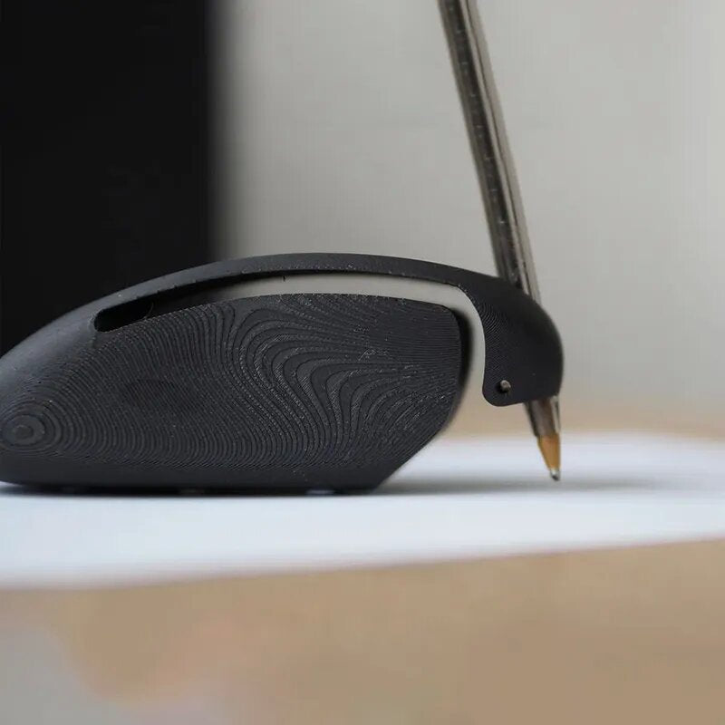 Close-up of a stylus pen being used on a digital device screen.