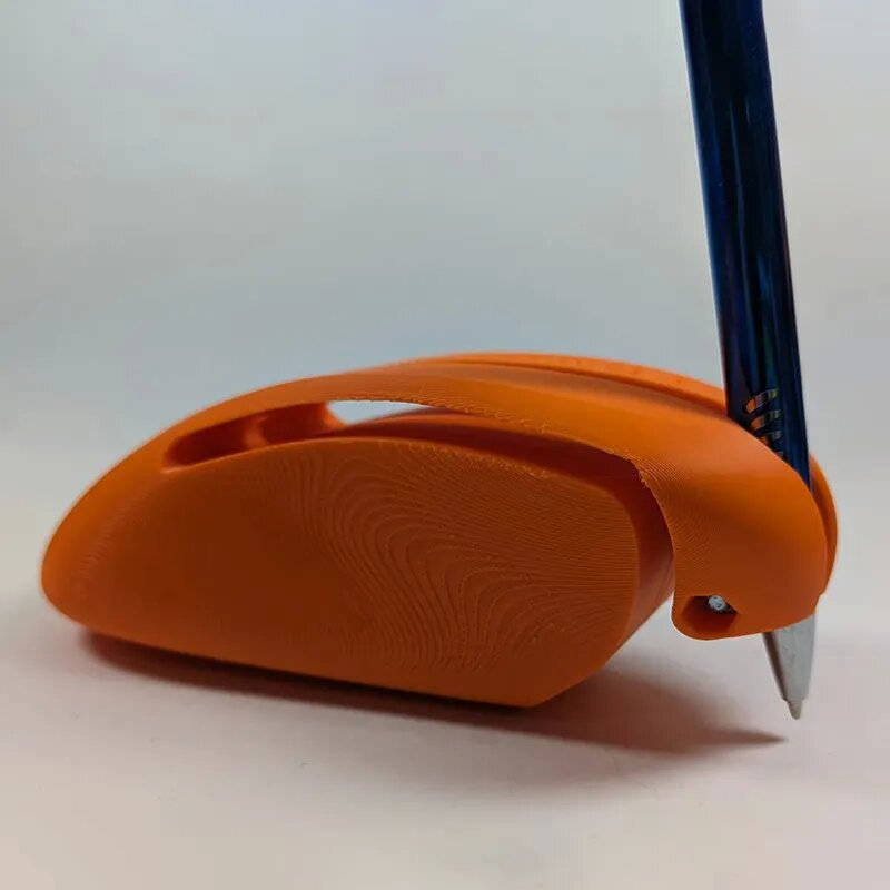 Orange pen holder with a blue pen on a white background