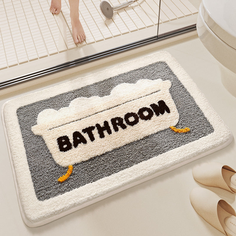 Bath mat with 'Bathroom' text on a bathroom floor