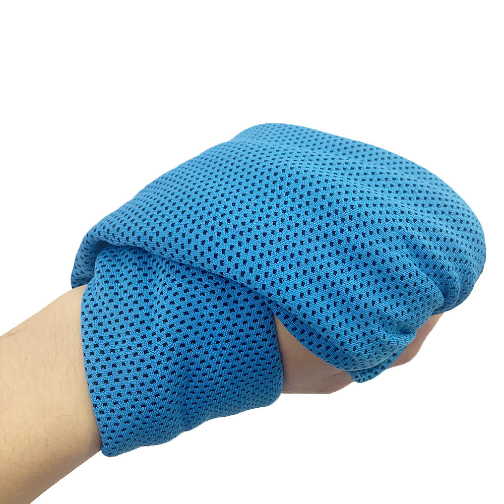 Blue textured towel wrapped around a hand on a white background
