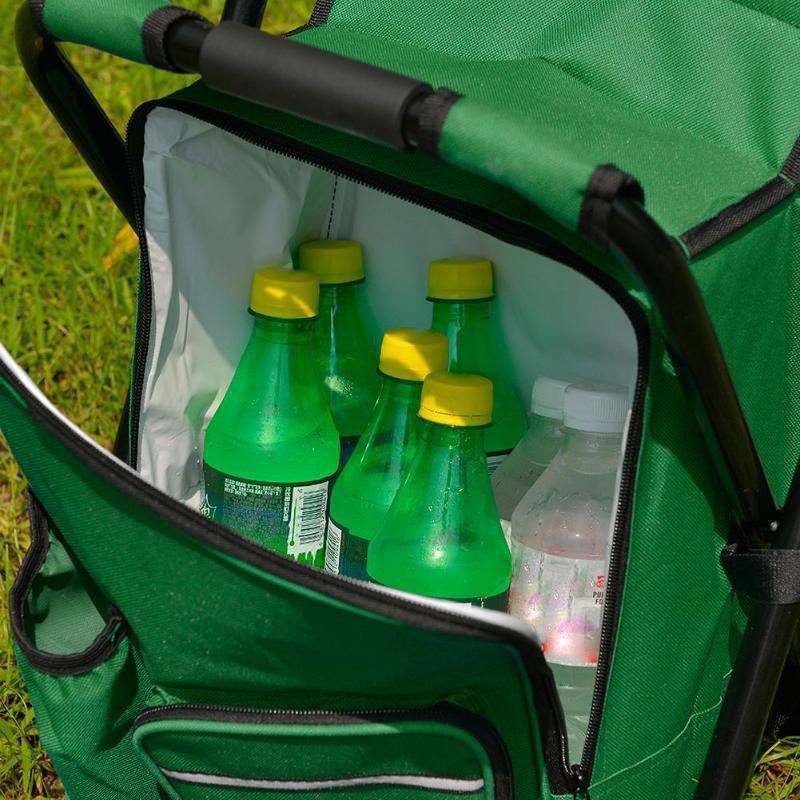 Green cooler bag with green bottles and a white bottle on grass