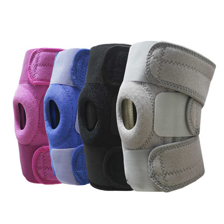 Four knee pads in different colors on a white background