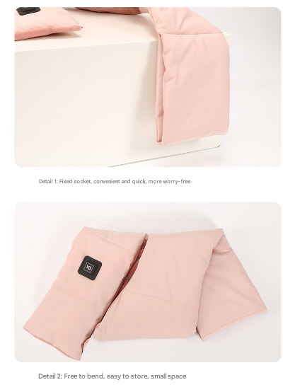 Foldable pink heating pad with a power button on a white background