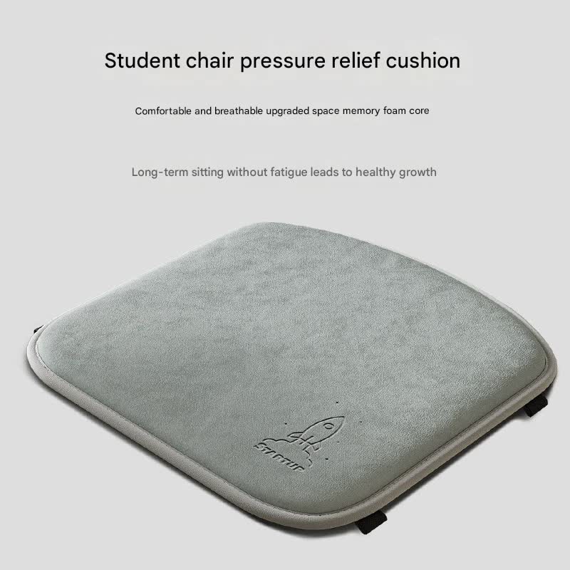 Gray student chair pressure relief cushion on a light gray background