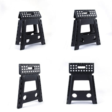 Four black folding stools on a white background