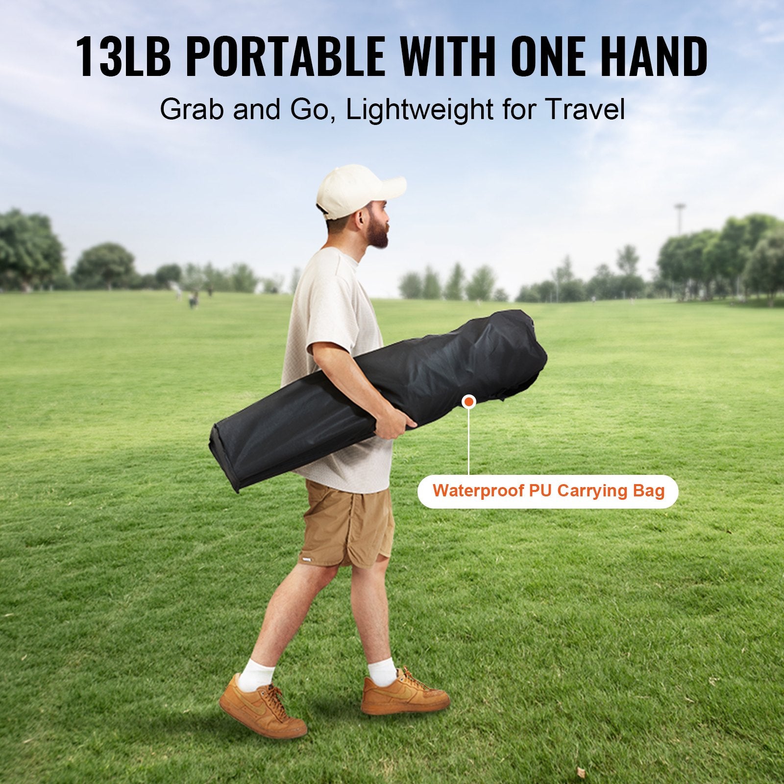 Man carrying a 13LB portable item with one hand on a grassy field.