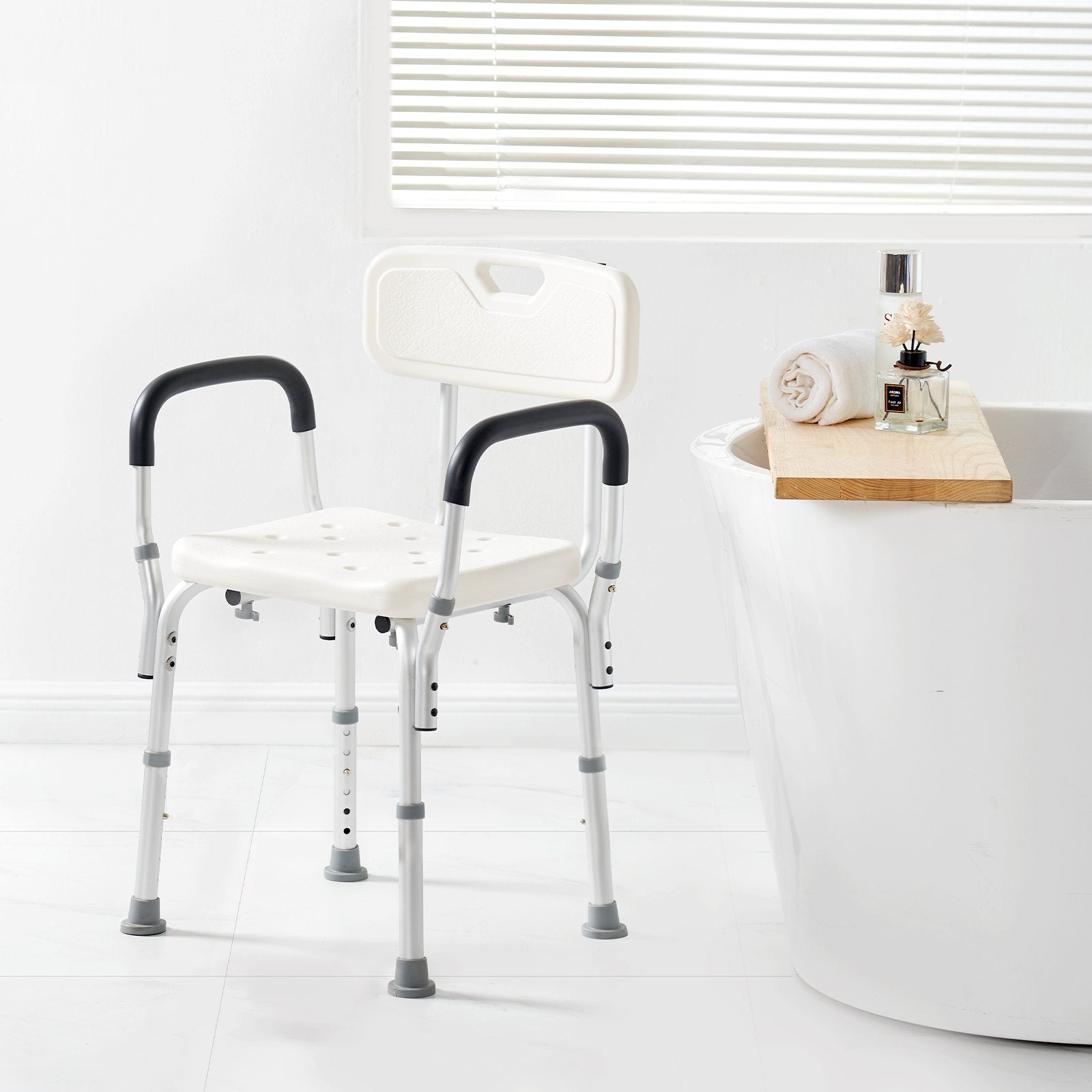 Bath support chair with backrest next to a bathtub in a bathroom setting.