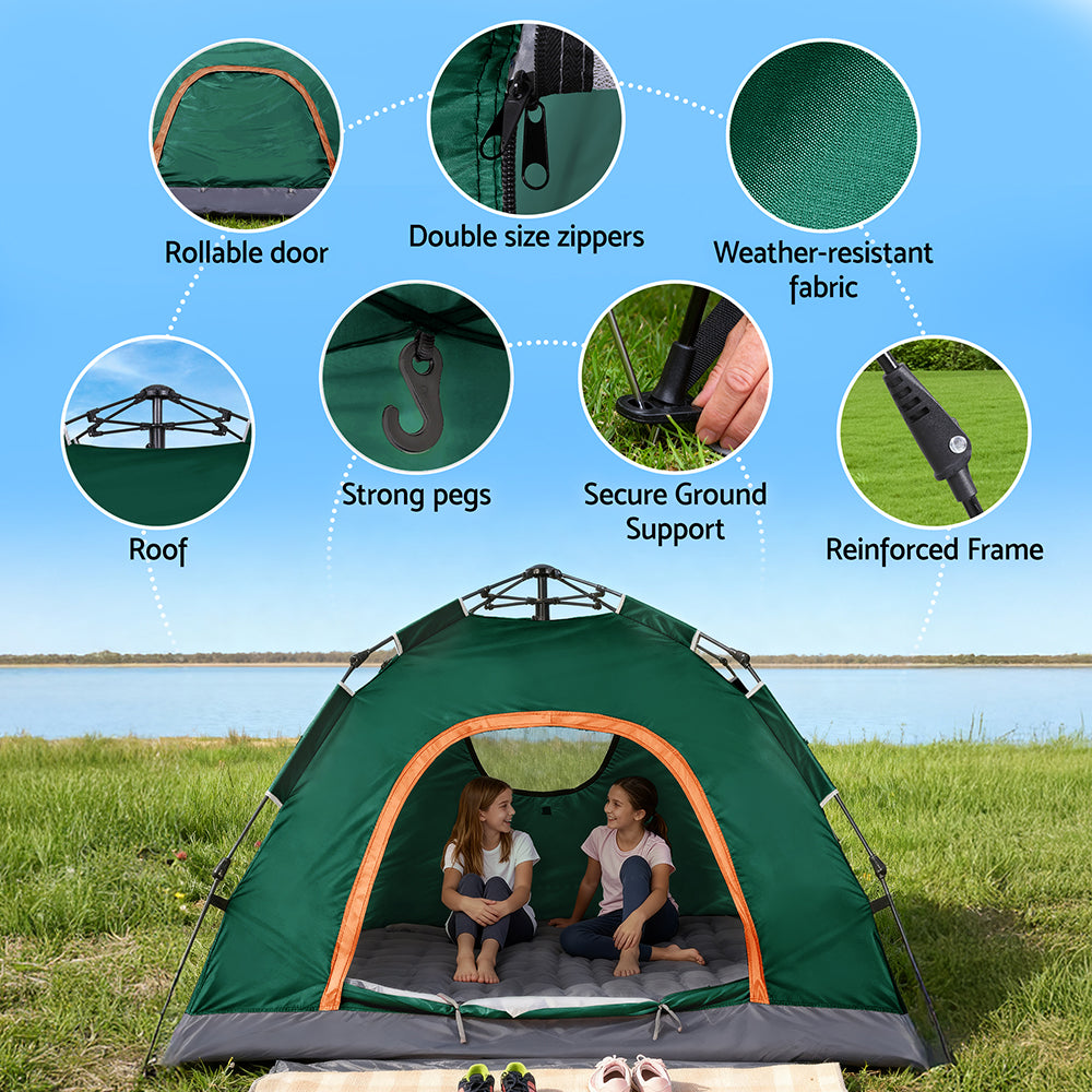 Green camping tent with features highlighted on a grassy field with a lake in the background